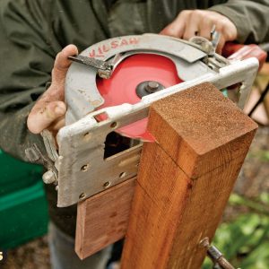 5. Use the block to guide the saw. After the first cut, reposition the block on the opposite face to finish the cut.