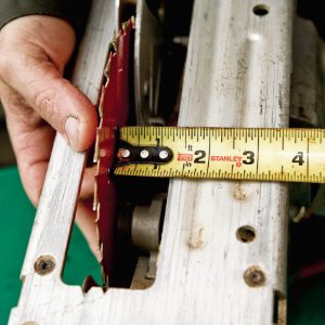 1. Measure the distance from the side of the blade to the edge of the saw base.