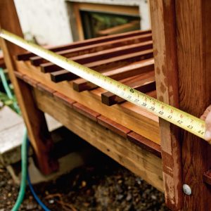 1. Measure the distance between two posts to begin calculating the baluster spacing.