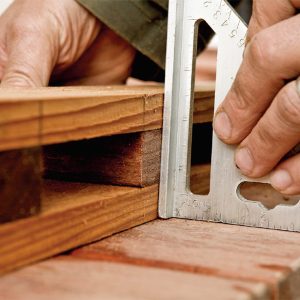 9. Flush the rails and balusters with a Speed Square before drilling the pilot holes.