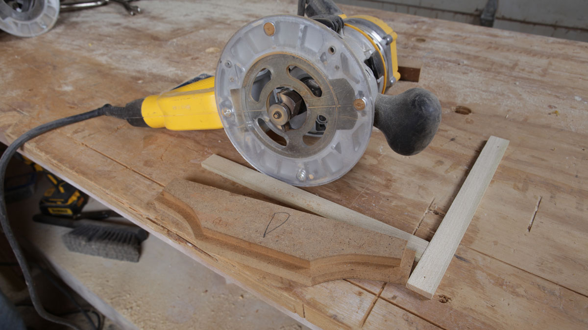 router sitting next to stepped corbel jig