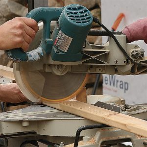 Cutting 70 balusters calls for precision. A stop block on a miter saw helps to make repeated cuts quickly and accurately. Seal the end grain with Anchorseal (uccoatings.com), a wax-based coating that reduces water wicking and discoloration.