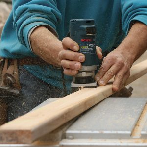 Ease the balusters’ cut edges with a roundover bit in a small router.