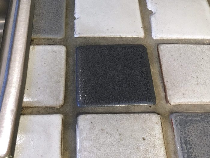 grout showing food and water stains