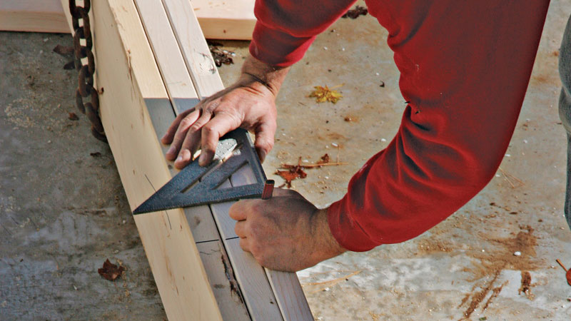 Joists made of dimensional lumber overlap at the support beam, so an F is marked on one side of the line to indicate where the front joists should land; a B locates the back joists.
