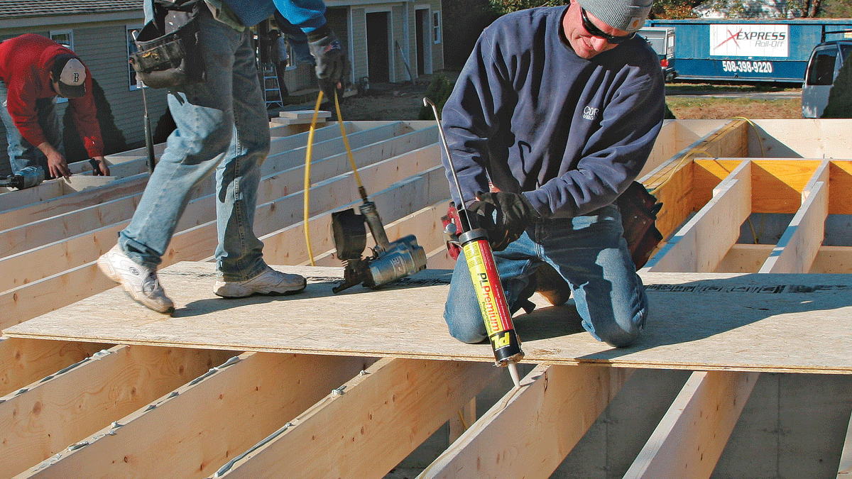 Construction adhesive prevents squeaks and stiffens the floor system. A sheet of floor sheathing provides a safe and comfortable platform from which to work.