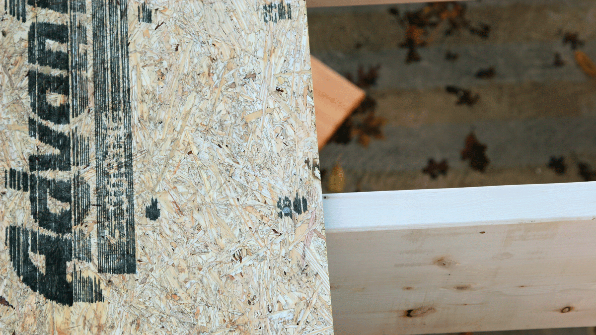 When the first sheet is in place, tack a corner to hold it at the centerline of the joist (photo 66). Then nail it to the remaining joists, guided by the layout marks printed on the sheathing (photo 67). This prevents the joists from wandering off course as subsequent sheets are installed.