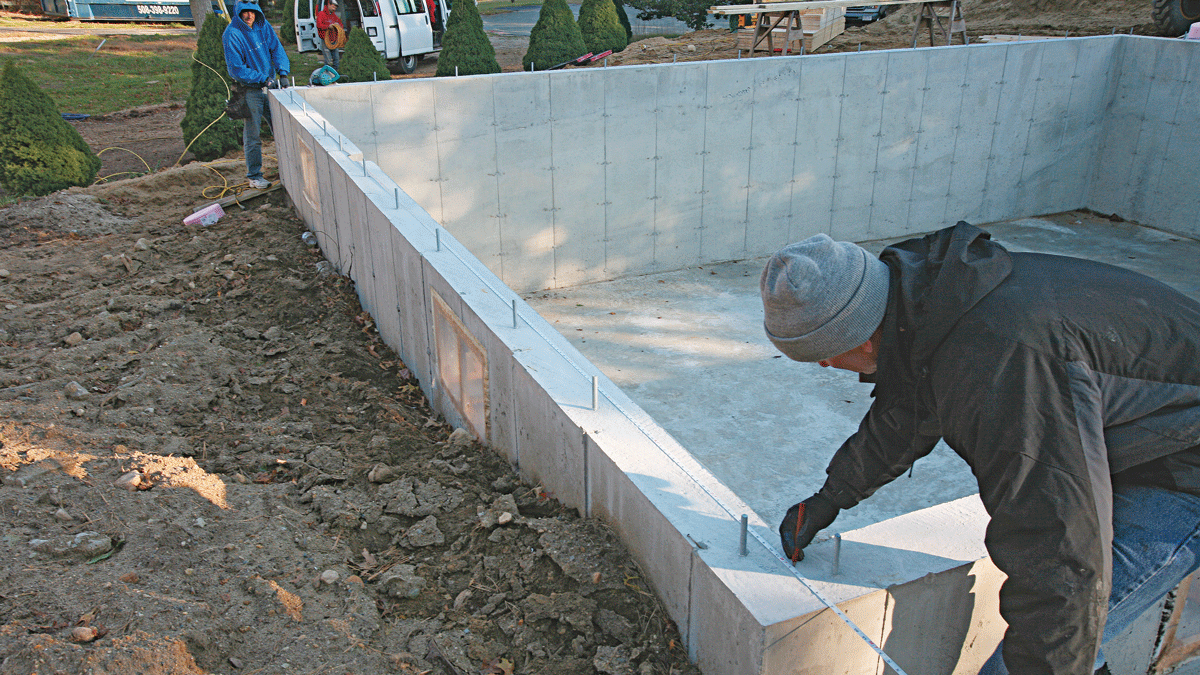 To establish a layout line for the parallel mudsill, measure and mark the same distance from the baseline at each end of the foundation, then snap a chalkline between the marks. Baseline wall Parallel wall