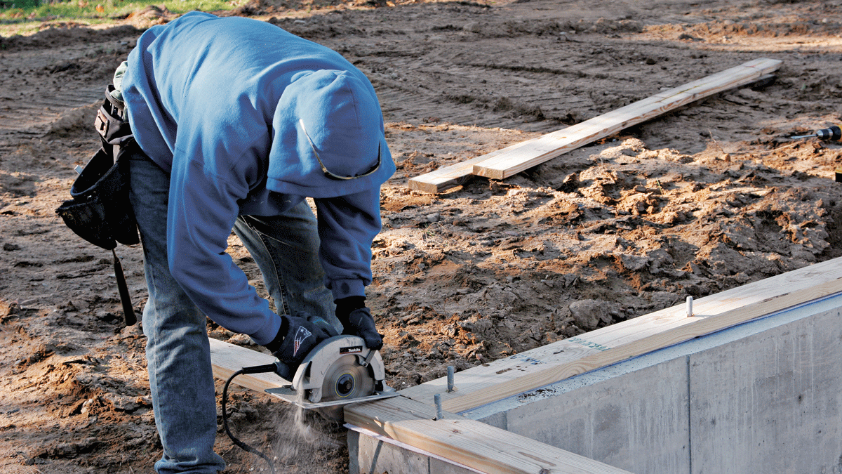 Once the nuts are snug, any portions of the mudsill that extend beyond the foundation should be trimmed off.