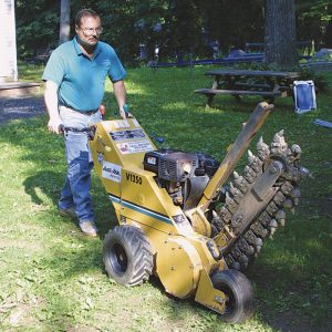 B  Rent a ditch-digging machine, also known as a trencher, to save time and avoid a sore back.