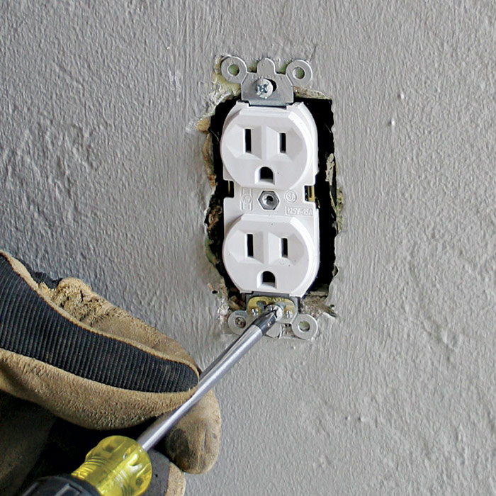 1  Turn off the power, remove the cover plate, and unscrew the receptacle.