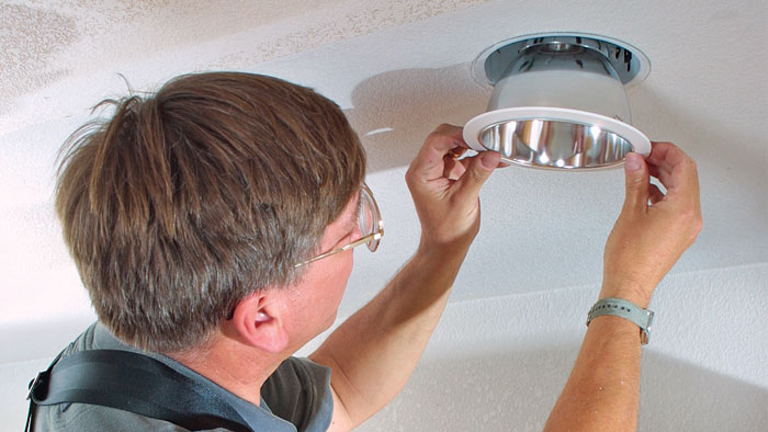 electrician installing recessed light