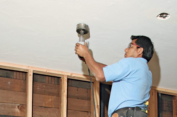 use a hole saw on each ceiling mark