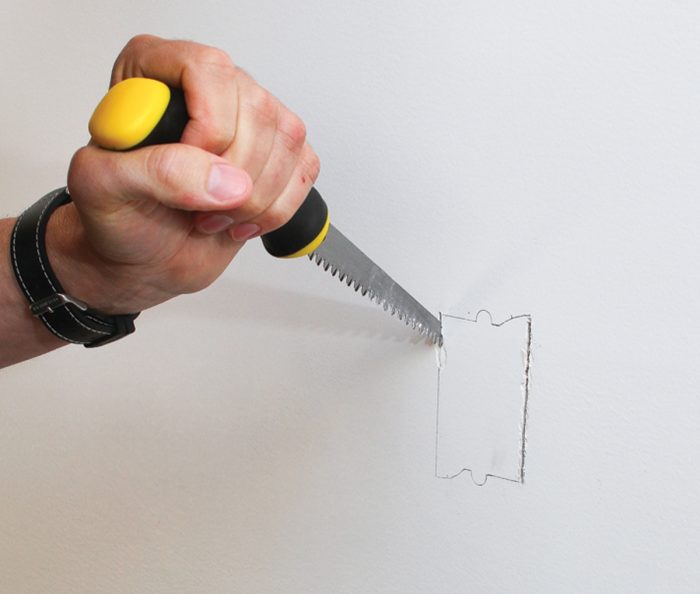 Use a jab saw to cut the opening in drywall.