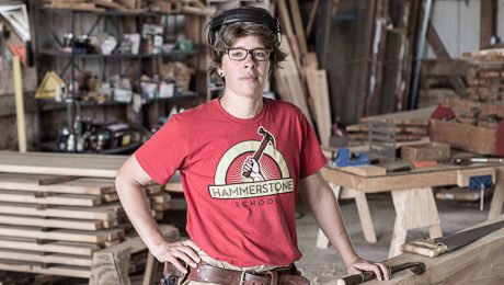Maria Klemperer-Johnson in a red shirt in a woodshop