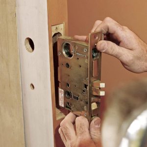 Holes in the lock case should align with the holes drilled into the door face
