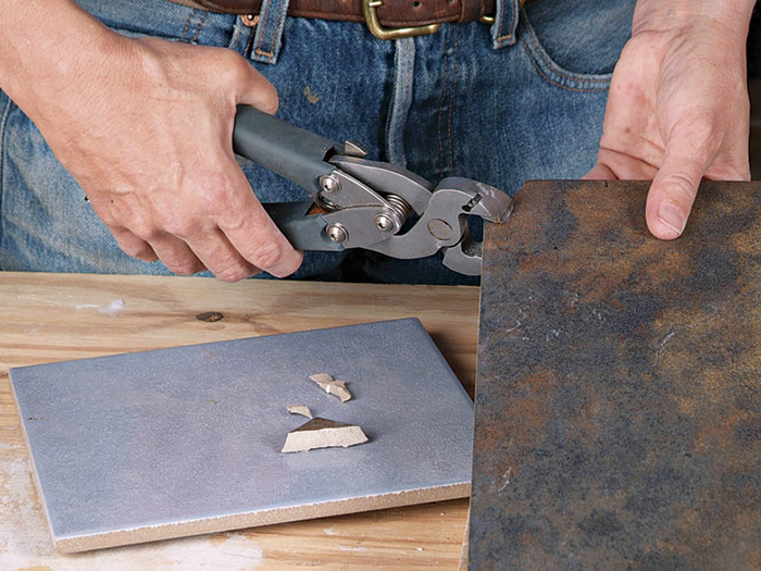 Although it’s expensive and a bit messy, an electric water saw can make all your tile-cutting chores much easier.