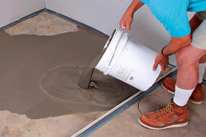After being mixed, self-leveling compound is poured over the floor up to 2 in. thick.