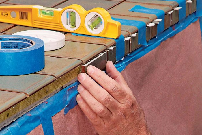 Quick-setting adhesives work well for tiling vertical surfaces.