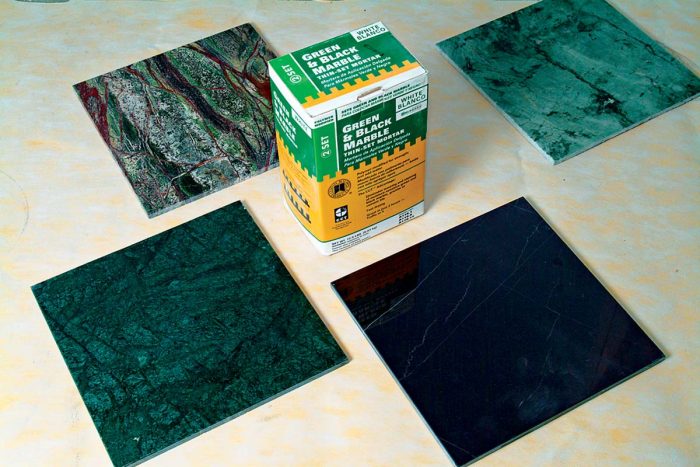 Marble tiles (green, red, and black) require their own special adhesive. Other adhesives cause these marbles to curl at the edges.