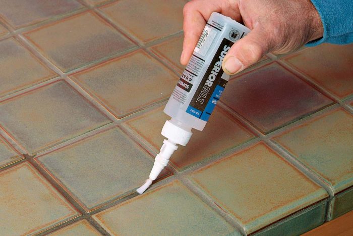 You can apply a penetrating sealer directly to the grout.
