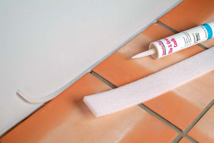 Expansion foam comes in rolls and can be easily cut to any width to fit the depth of the grout joints before adding caulk.