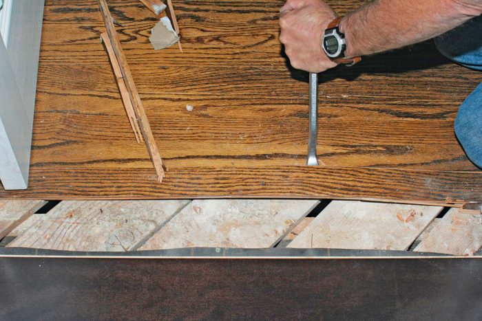Then use a prybar to get under your wood planks, strips, or squares.