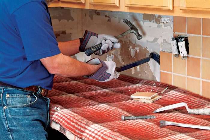 Carefully remove backsplash tiles, to prevent excessive damage to the drywall.