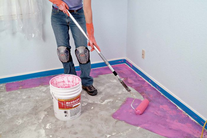 Apply paste antifracture membrane to a floor using a long-handled roller.