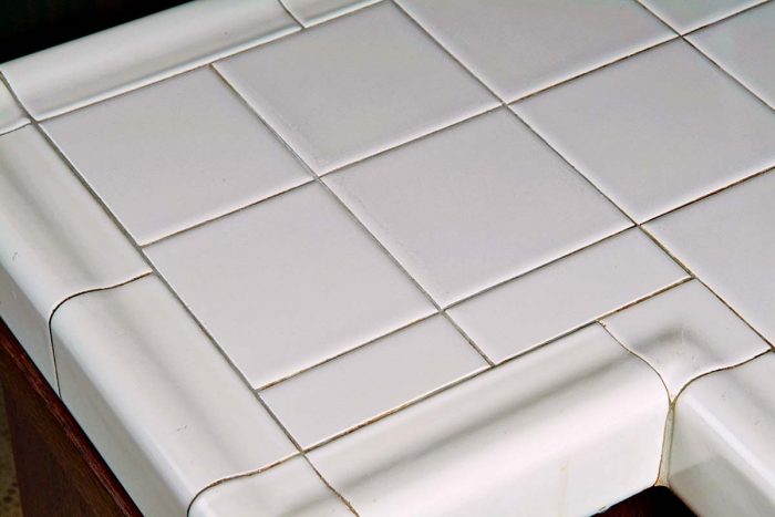 Narrow cut tiles aren’t a first choice, but sometimes they allow the rest of the countertop to lay out beautifully.