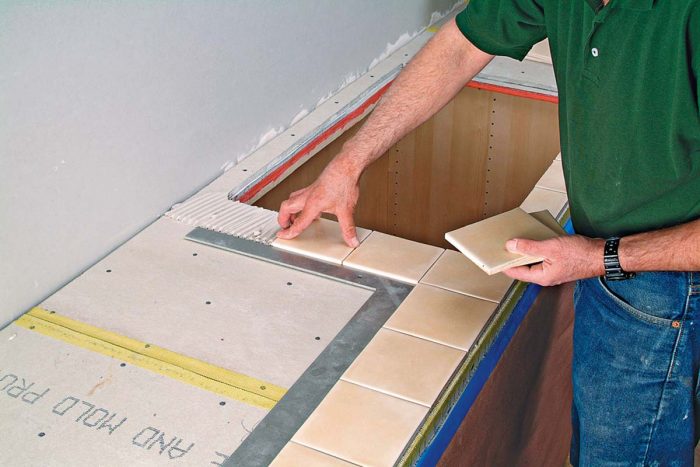 Dry-lay the tile on your work surface to check spacing and cuts.