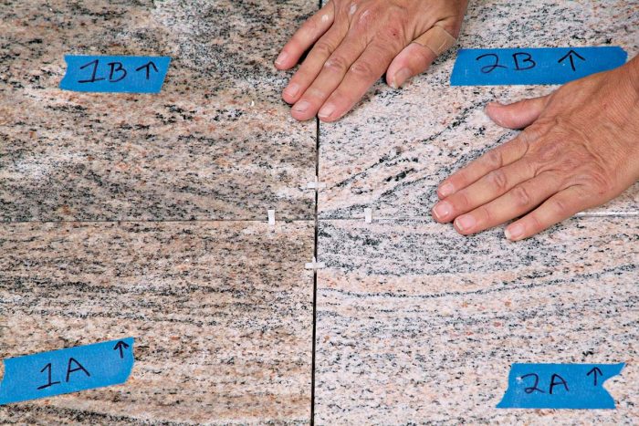 X-shape 1⁄16-in. spacers keep stone tiles properly aligned for even grout joints.