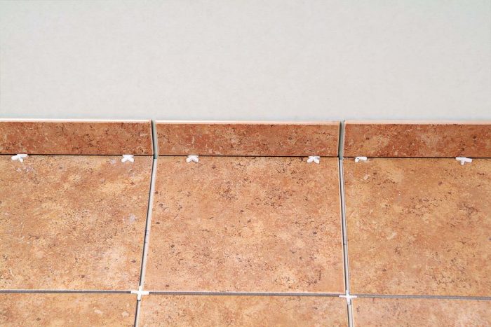 Tile base adds a nice finish to a tile floor and protects the bottom edge of the wall.