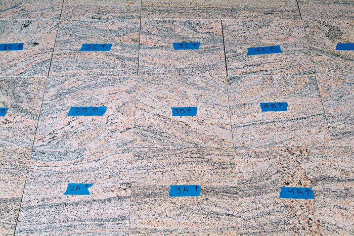 When you have chosen the pattern for your stone floor, label and mark each one with letters and numbers for rows and columns and add an orientation direction.