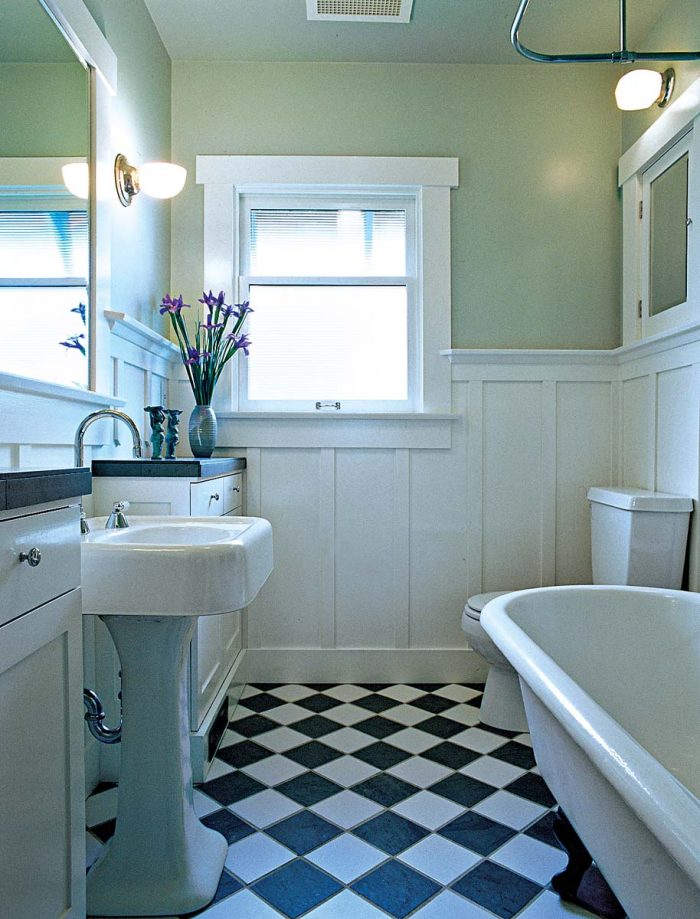 Tiles set on the diagonal in a classic checkerboard pattern open up this small bathroom.