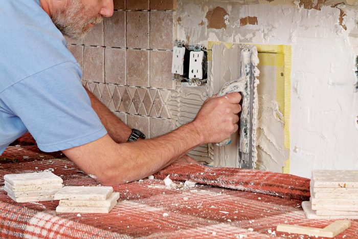 Apply thinset carefully over any repaired and taped area of a wall.