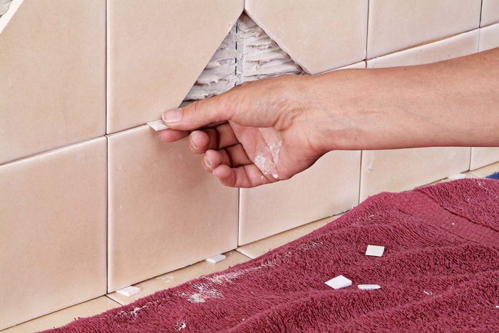 Use wedges to help maintain even grout joints between tiles and hold them in place until the thinset dries.