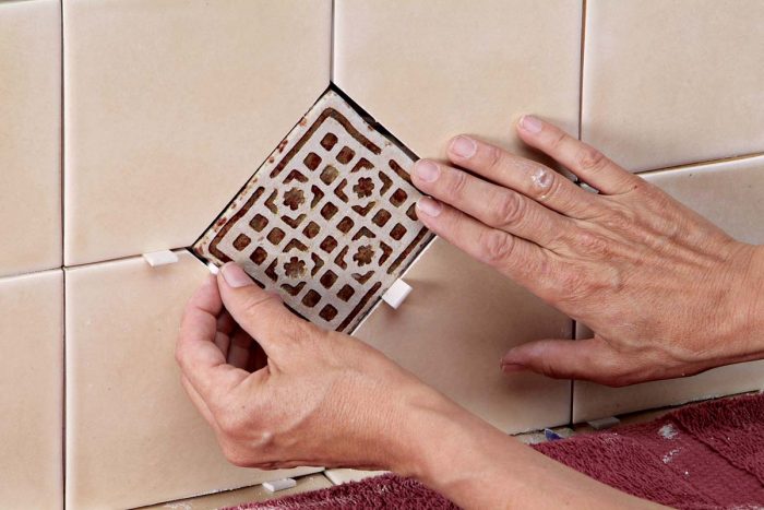 Wedges help keep an even grout joint around each decorative tile.
