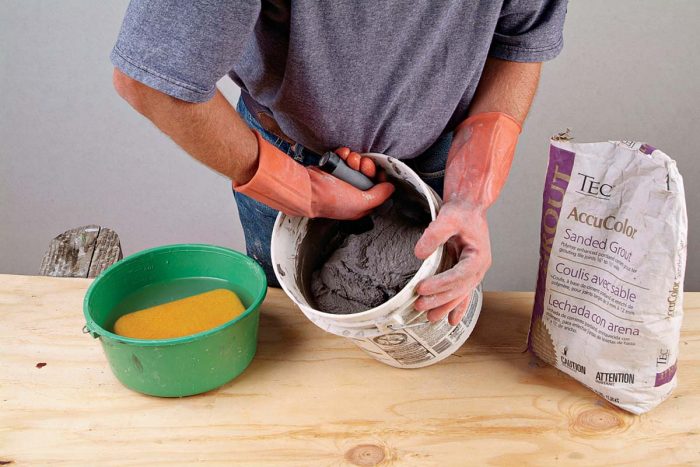 Mix grout completely, scraping the sides and bottom of the bucket.