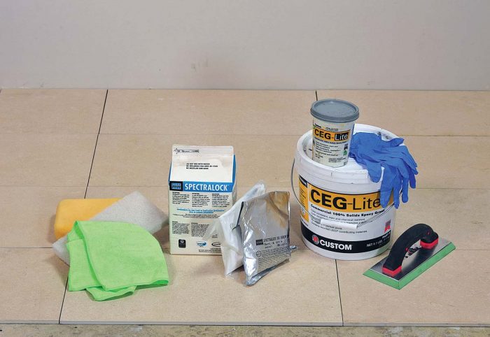 Have all your tools ready to go before mixing up a batch of epoxy grout. An epoxy grout float (at right) is harder and heavier than a standard float and nonporous to resist gumming up from the epoxy.