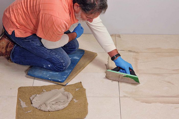 Use an epoxy float to fill the grout joints fully but be sure to remove any excess grout from the face of the tile.