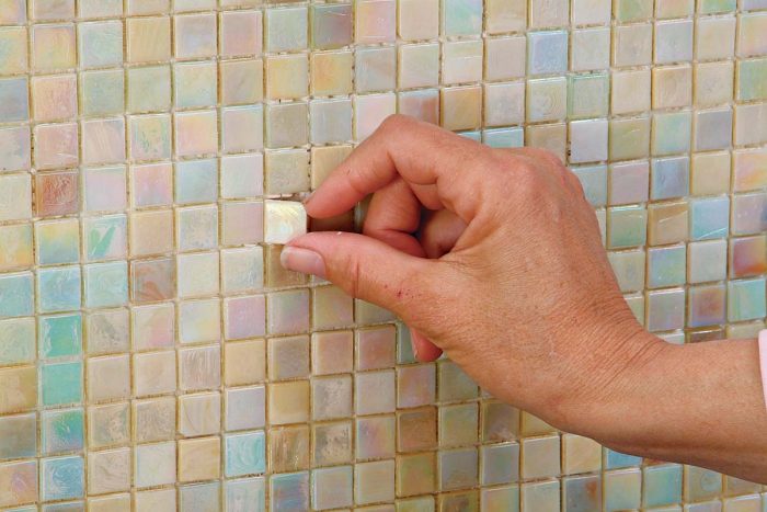 Don’t be alarmed if a mosaic tile pops off while you’re cleaning.