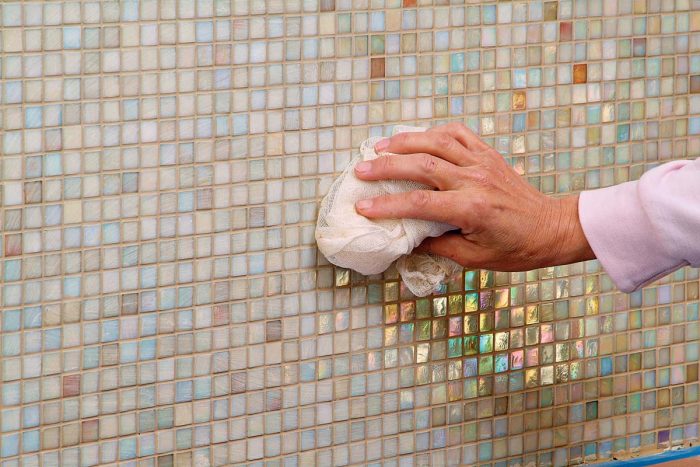 Polish off any grout haze from the glass to leave a shimmering surface.