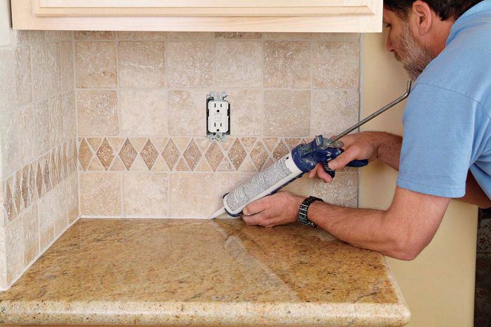 Move steadily along the grout joint as you apply a continuous, smooth bead of caulk.