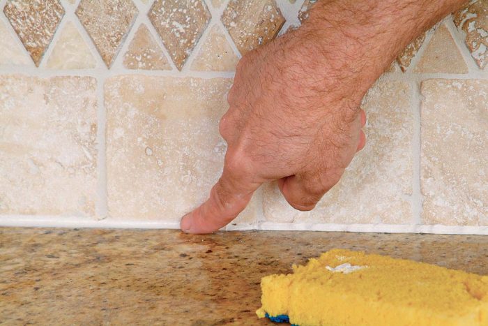 Use a damp finger to smooth and shape the caulk joint.