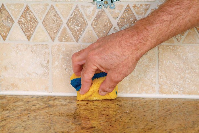 Use a damp noncellulose or shed-free sponge to remove caulk residue.