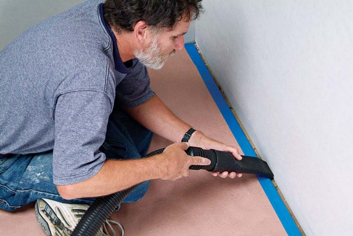 Vacuum out any debris from the joint before caulking.