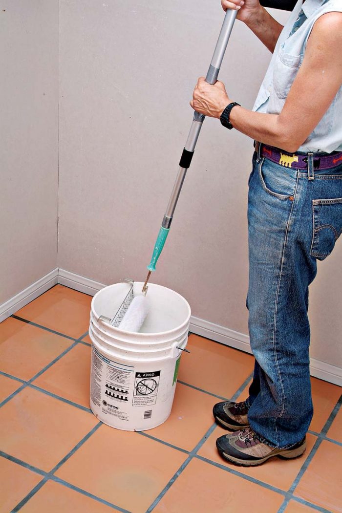 For large floors, apply the sealer with a paint roller with a 1⁄4-in. nap, mounted on a pole handle.