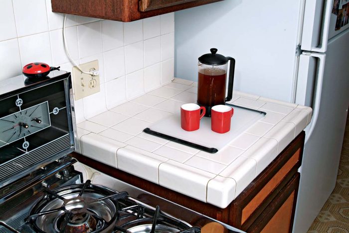 A cutting board or mat will save wear and tear on your countertop and catch errant drops or spills.