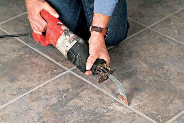 A carbide grout blade attached to your reciprocating saw quickly removes grout from around tiles.
